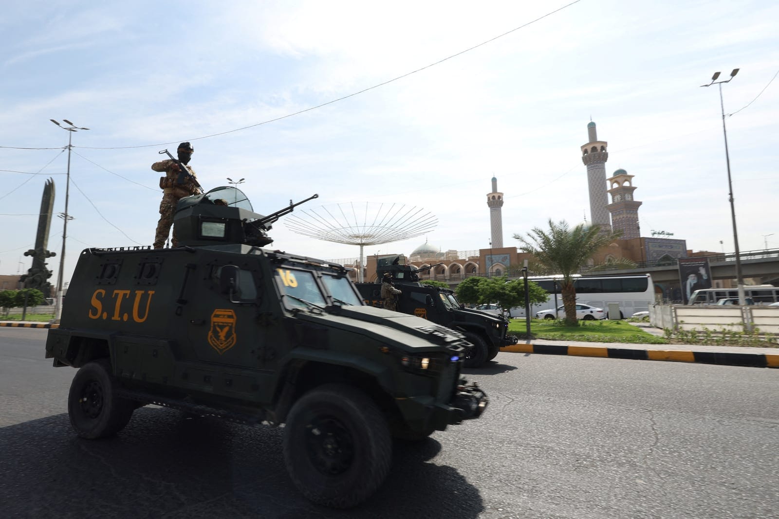 Members of the Iraqi security forces drive in a convoy through the city as they celebrate the withdrawal of US-led coalition forces from Iraq, ending a military presence that began after the 2003 US-led invasion, in Najaf, Iraq, September 30, 2026. R