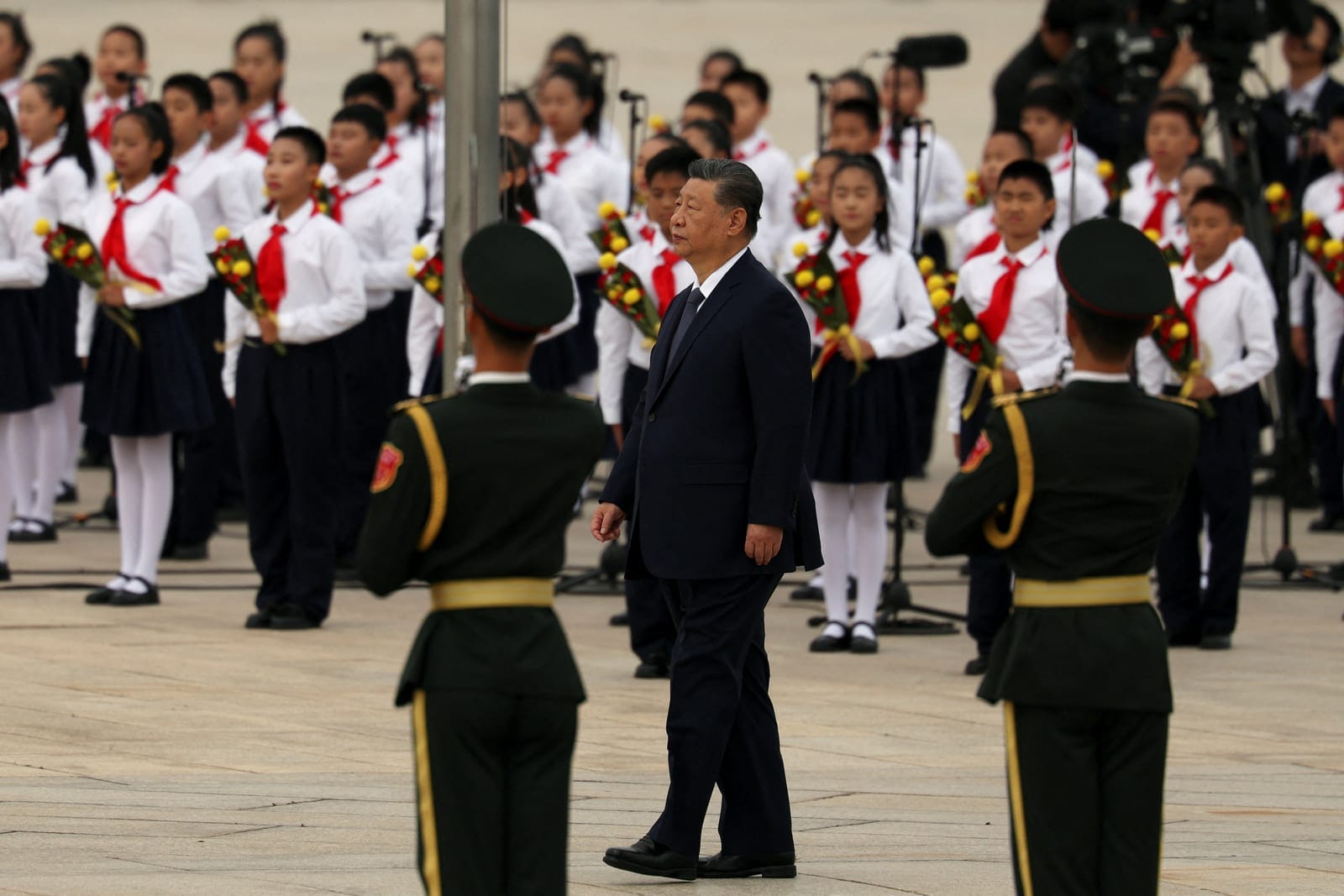 Chinese President Xi Jinping walks past choir and honour guard members during a ceremony to mark Martyrs' Day, a day ahead of the Chinese National Day, on Tiananmen Square in Beijing, China September 30, 2026. REUTERS/Florence Lo