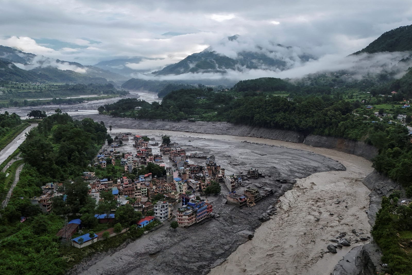 A drone view shows mud covering properties following a flash flood in Trishuli, Nuwakot district, Nepal, August 27, 2026. REUTERS/Navesh Chitrakar