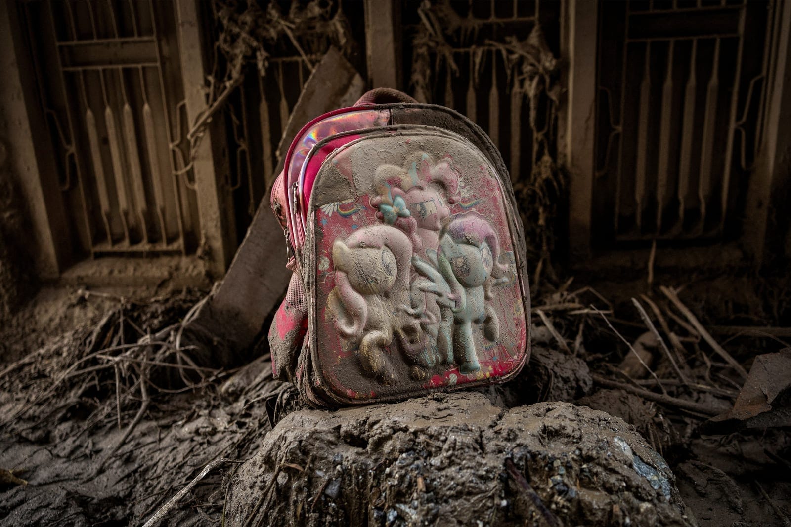 A school bag lies amid debris and mud on the ground outside a damaged house following the flash floods and a mudslide, in Devighat, Nuwakot district, Nepal, August 30, 2026. REUTERS/Adnan Abidi