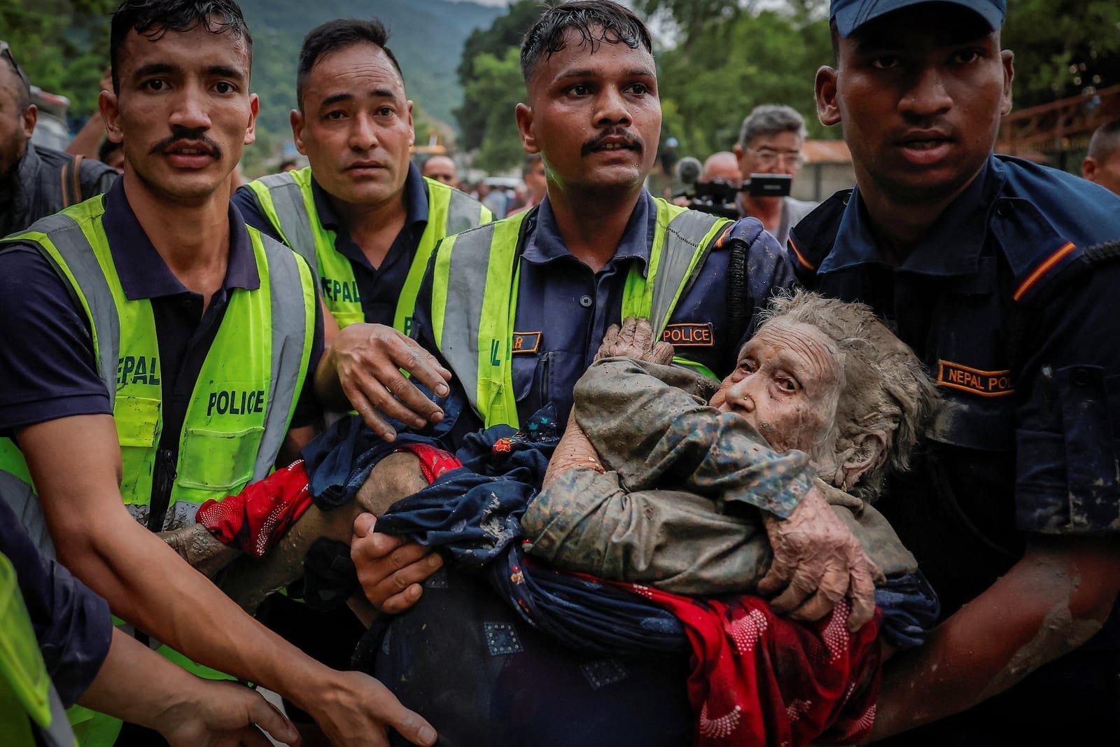 Police officers carry a survivor to a safer place following a flash flood at Trishuli in Nuwakot district, Nepal, August 26, 2026. REUTERS/Navesh Chitrakar