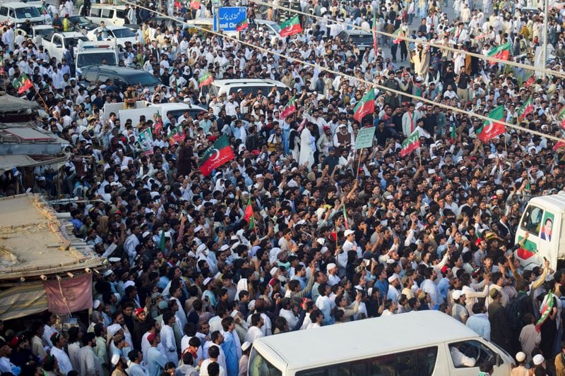 Supporters of the Pakistan Tehreek-e-Insaf (PTI) party gather during a protest march in Lakki Marwat