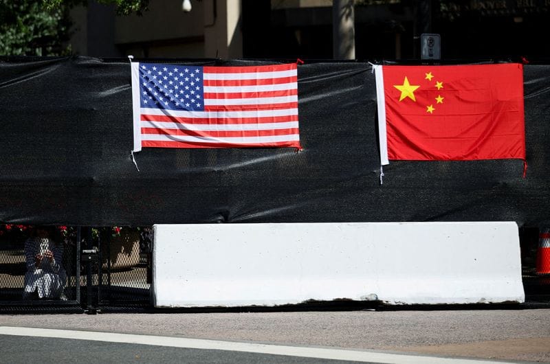 FILE PHOTO: US President Donald Trump and China's President Xi Jinping meet at the White House