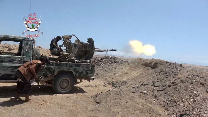 FILE PHOTO: A pro-Saudi-backed Yemeni government fighter fires a vehicle-mounted weapon during what government forces say was an advance against the Iran-backed Houthis, near Dhubab