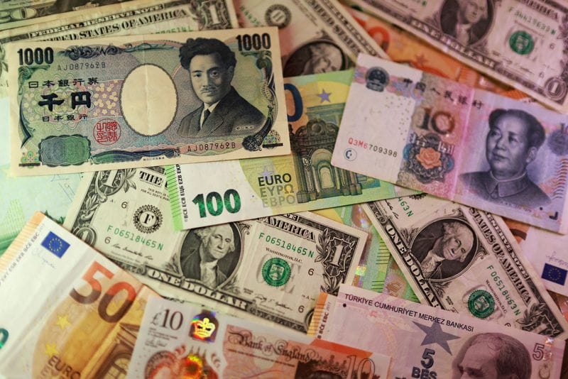 Illustration shows U.S. dollar, Euro, Yen, Pound, Turkish Lira, Yuan banknotes