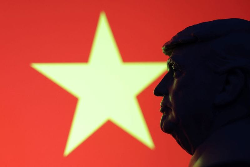 Illustration shows 3D-printed miniature model of U.S. President Donald Trump, Vietnam flag