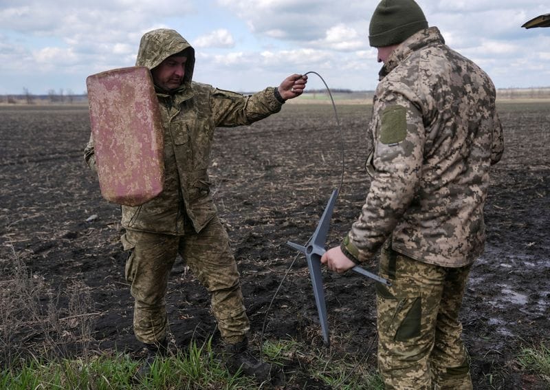 FILE PHOTO: Ukrainian servicemen set up Starlink satellite internet system near the frontline town of Pokrovsk