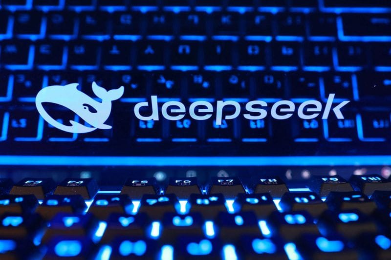 Illustration shows Deepseek logo and keyboard