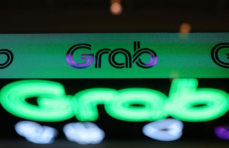 A logo of Grab is displayed at their office in Singapore