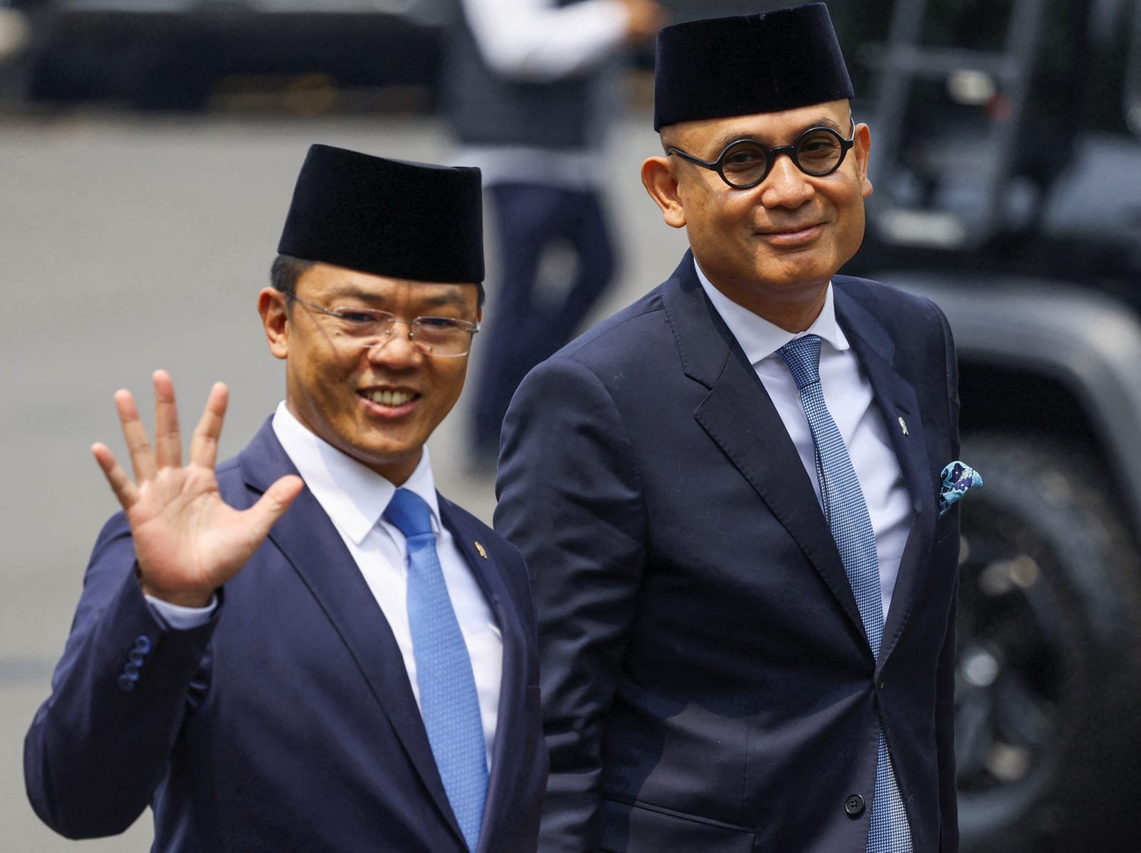 Indonesia's Foreign Minister Sugiono gestures as he and his deputy Arrmanatha Nasir arrive at the presidential palace for the inauguration in Jakarta, Indonesia, October 1, 2026. REUTERS/Ajeng Dinar Ulfiana