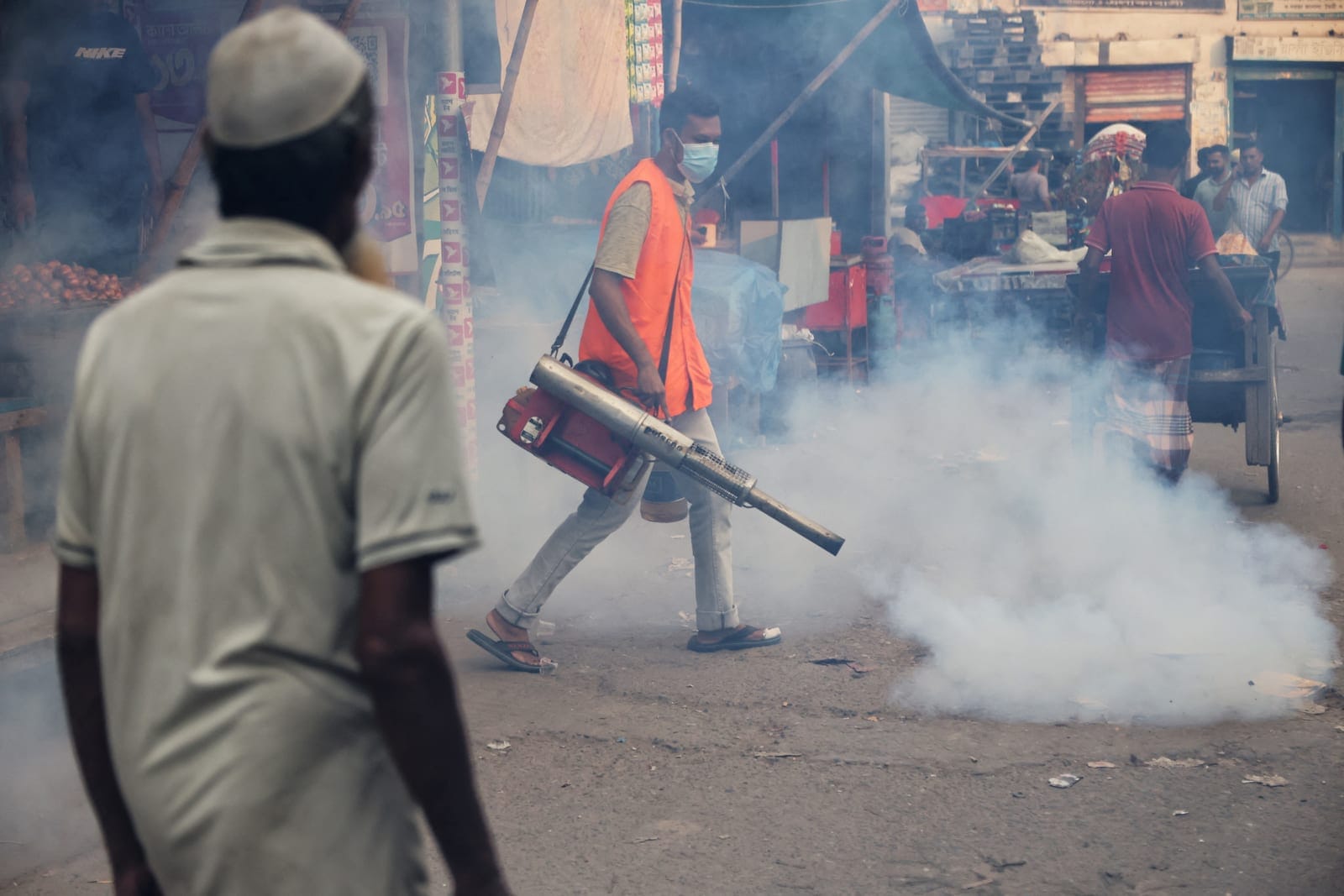 A man fumigates a road as a preventive measure against mosquito-borne diseases, particularly dengue, in Dhaka, Bangladesh, October 1, 2026. REUTERS/Mohammad Ponir Hossain