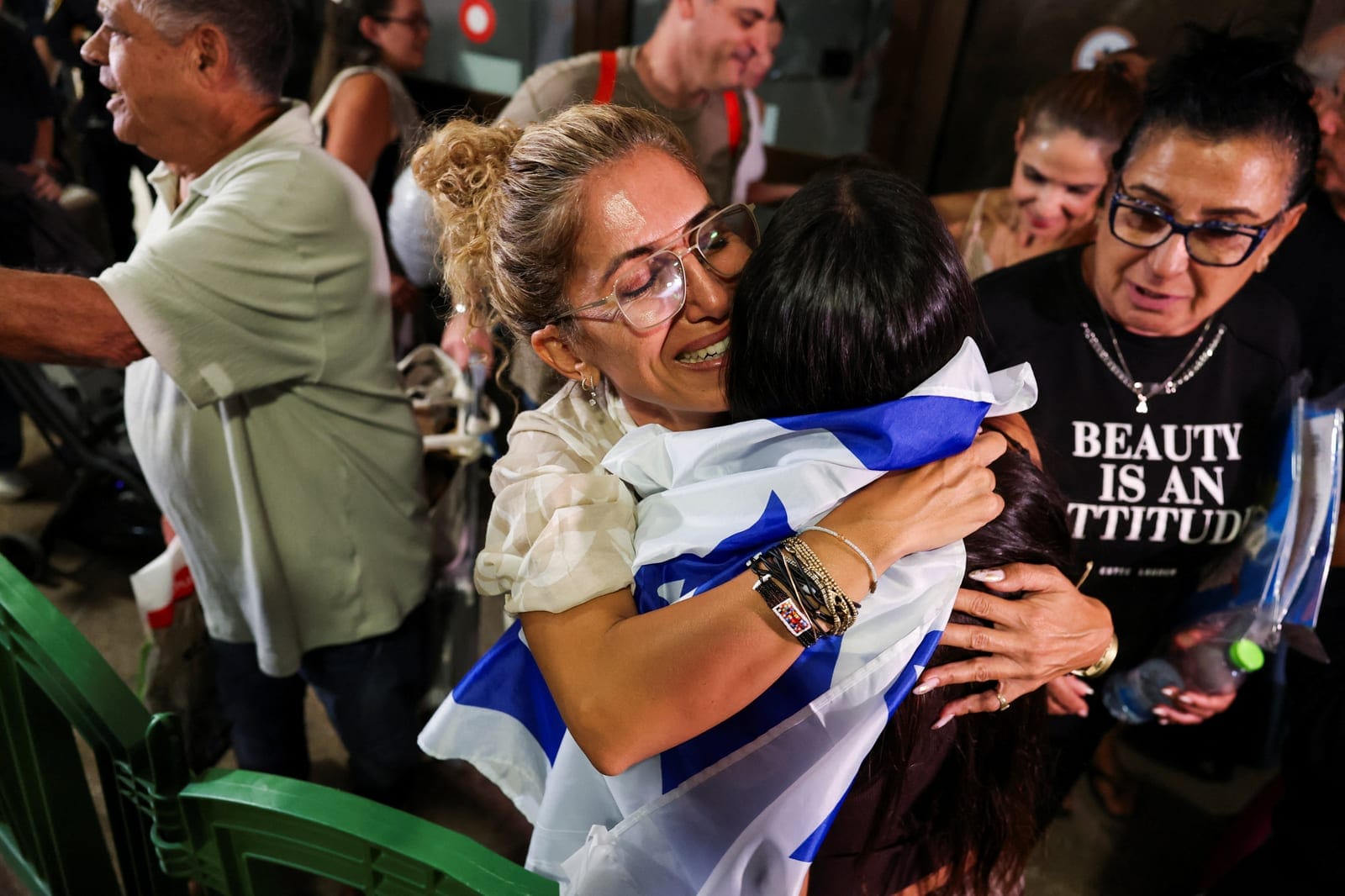 Passengers who were on the FlyDubai aircraft bound for Israel from the United Arab Emirates, which was diverted to Saudi Arabia following an emergency signal, are greeted by their friends and family, as they arrive at the Ben Gurion International Air