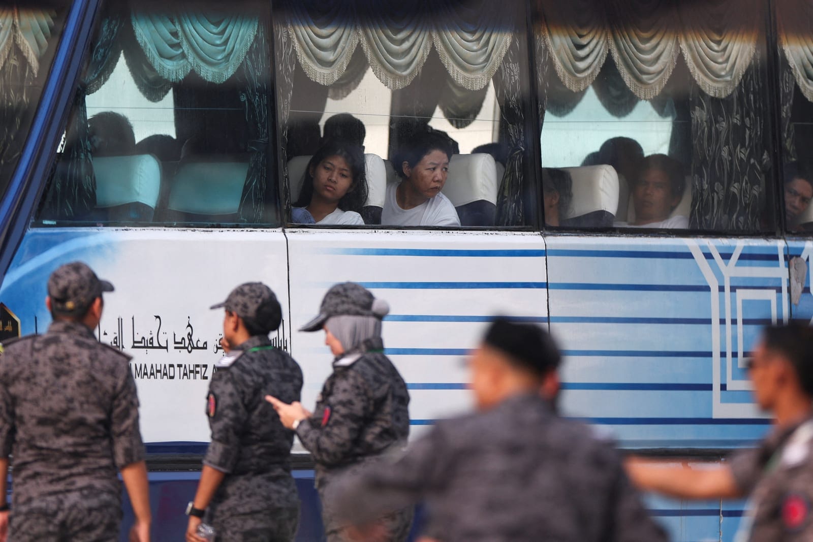 Myanmar nationals to be repatriated from Malaysia sit inside a bus, at Lumut, Malaysia, September 29, 2026. REUTERS/Hasnoor Hussain
