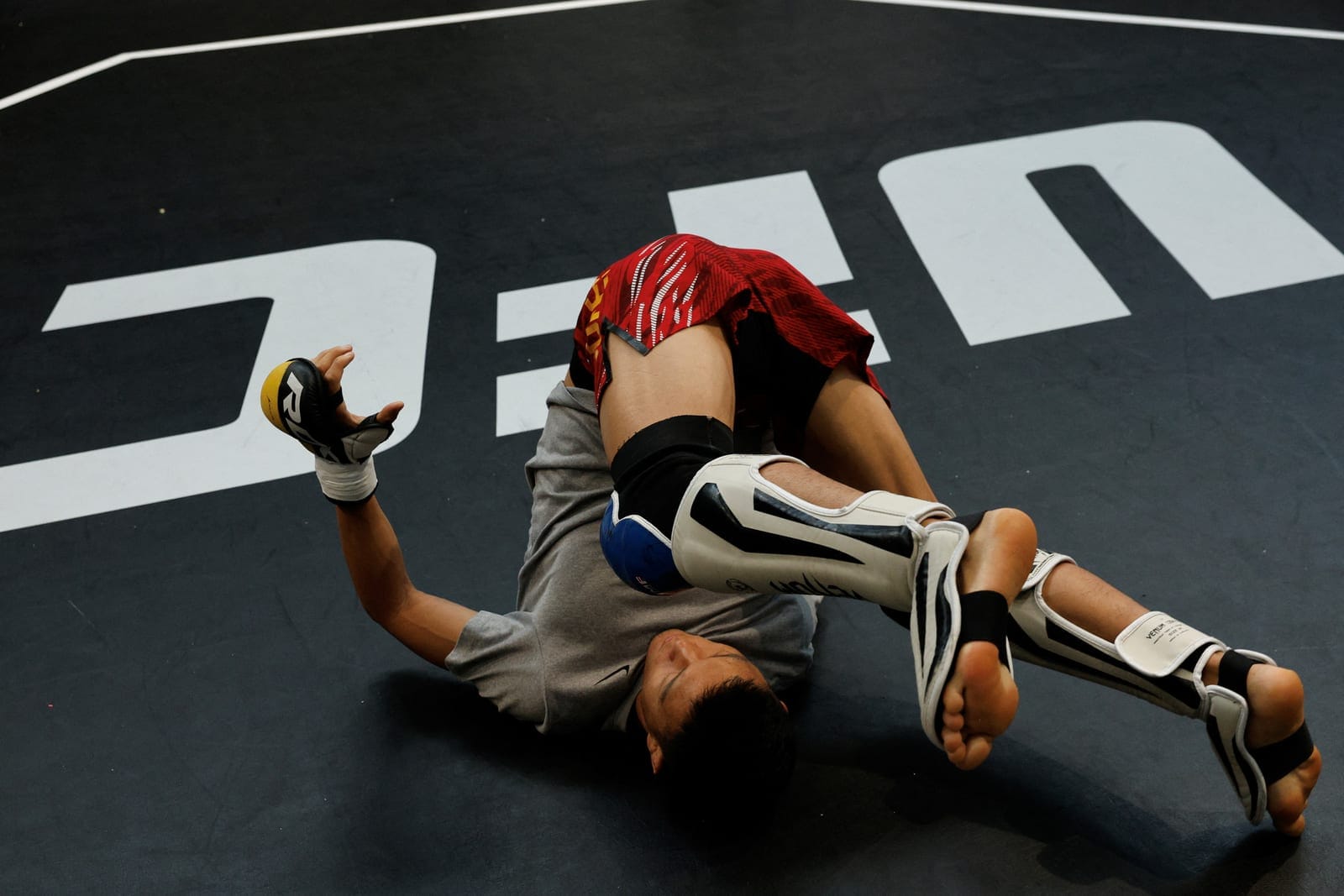 UFC flyweight fighter Su Mudaerji warms up before a sparring session at the UFC Performance Institute in Shanghai, China, August 20, 2026. REUTERS/Go Nakamura