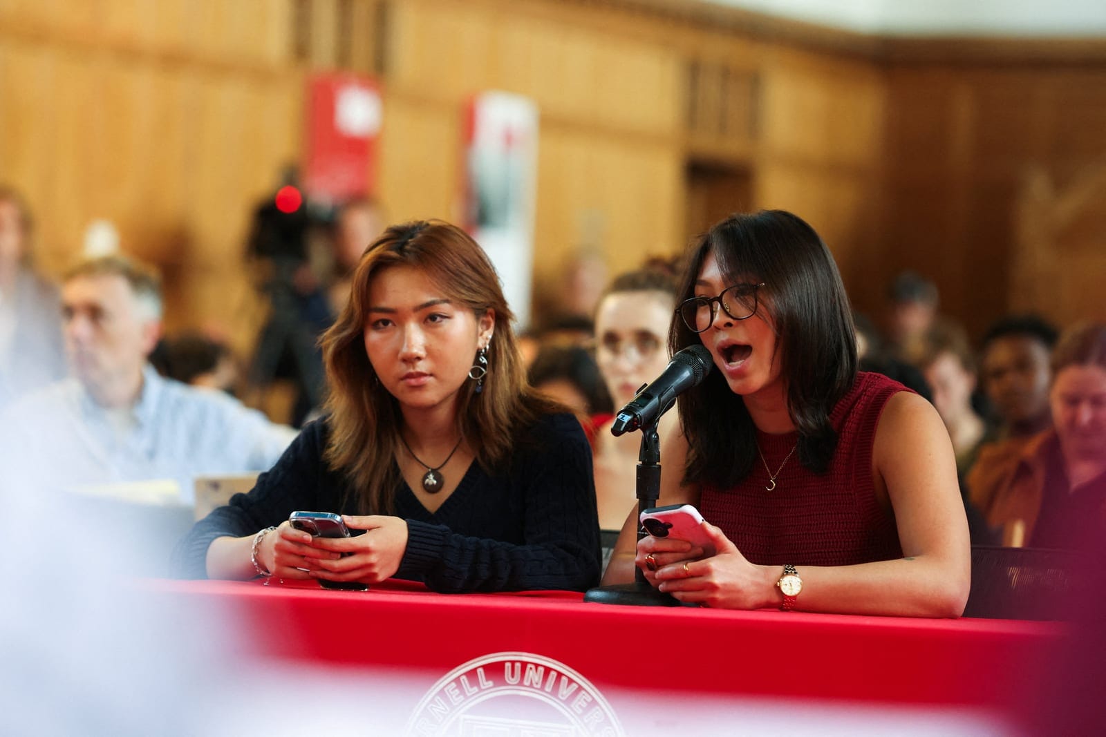 Jane Wang, left, and Sophia Riley Sim, with Cornell University’s ACLU, a student organization that advocates for civil rights, address the student assembly on Sexual Violence held at Cornell University, amid the Chi Phi Lawsuit, in Ithaca, New York, 