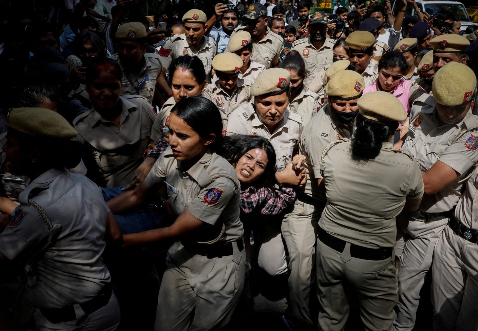 Police officers detain a protester during a protest demanding the resignation of India's Chief Election Commissioner Gyanesh Kumar, in New Delhi, India, October 2, 2026. REUTERS/Adnan Abidi