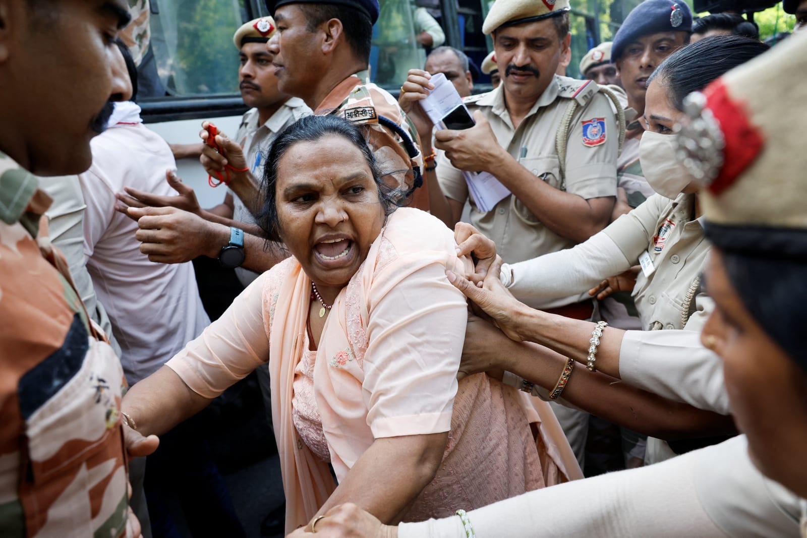 Police officers detain protesters during a protest demanding the resignation of India's Chief Election Commissioner Gyanesh Kumar, in New Delhi, India, October 2, 2026. REUTERS/Adnan Abidi
