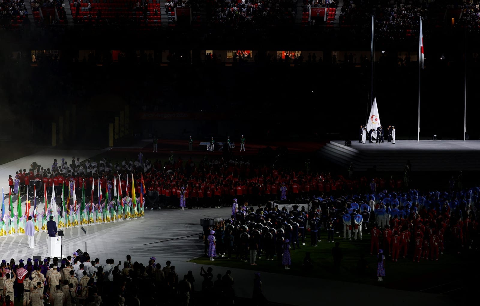 Asian Games - Aichi-Nagoya 2026 - Closing Ceremony - Paloma Mizuho Stadium, Nagoya, Japan - October 4, 2026 Members of the Japan Self-Defence Forces lower the OCA flag during the closing ceremony REUTERS/Edgar Su