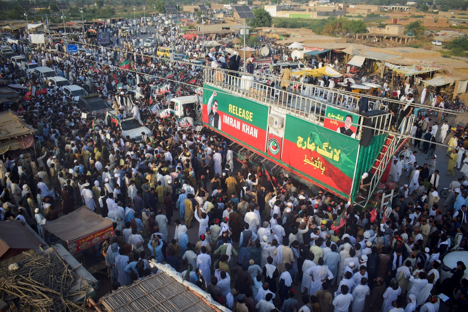 Supporters of former Pakistani Prime Minister Imran Khan's party, Pakistan Tehreek-e-Insaf (PTI), gather during a protest march demanding his release and calling for the supremacy of the Constitution and the rule of law across the country, in Lakki M