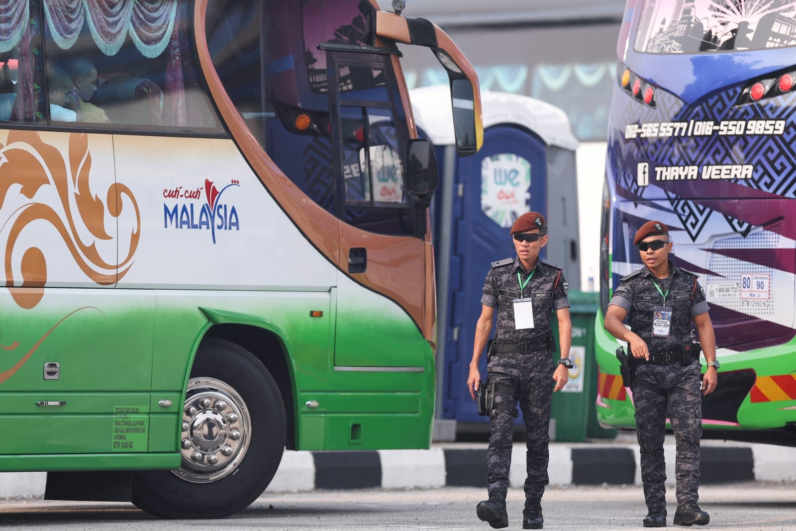 Malaysian Immigration officers stand during the repatriation of Myanmar nationals at Lumut, Malaysia, September 29, 2026. REUTERS/Hasnoor Hussain