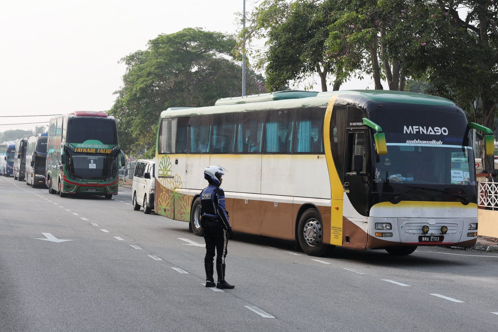 Buses carrying Myanmar nationals line up during the repatriation process at Lumut, Malaysia, September 29, 2026. REUTERS/Hasnoor Hussain