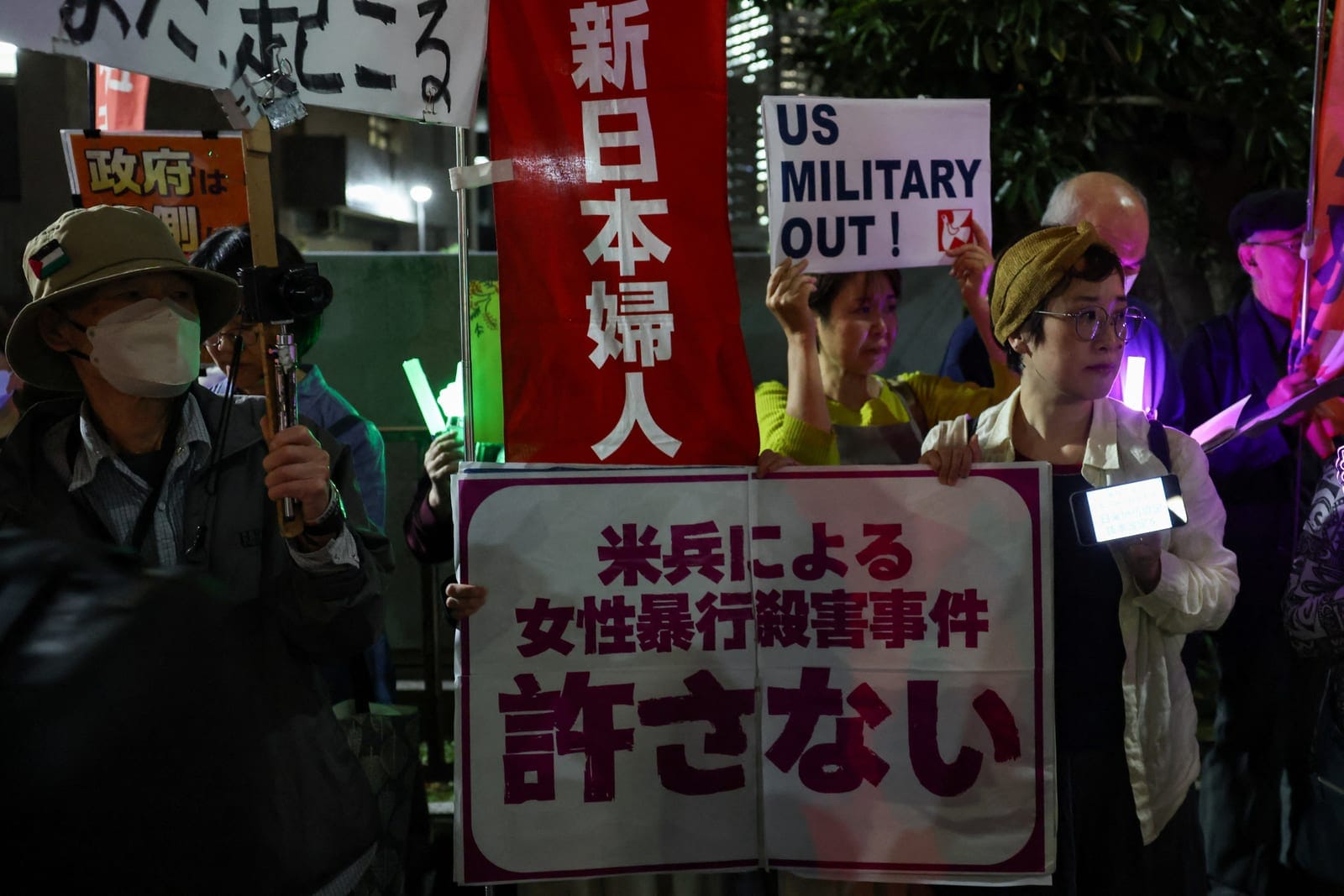 Demonstrators take part in a protest outside the Prime Minister's office following the killing of a Japanese woman in Okinawa, for which a US Marine is a suspect, in Tokyo, Japan, October 5, 2026. REUTERS/Kim Kyung-Hoon