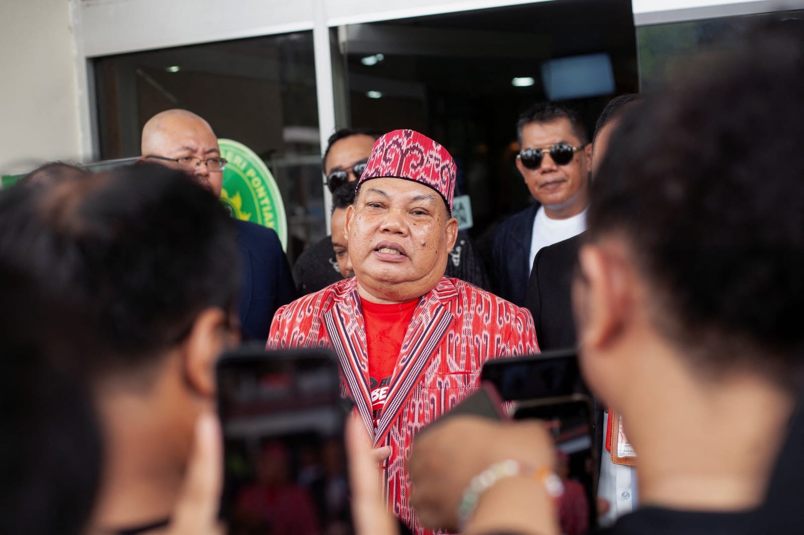 Yakobus Kumis, a plaintiff representing the Dayak ethnic group, speaks to the media after the first hearing of a class action lawsuit over the government's handling of forest and land fires at the Pontianak District Court in Pontianak, West Kalimanta