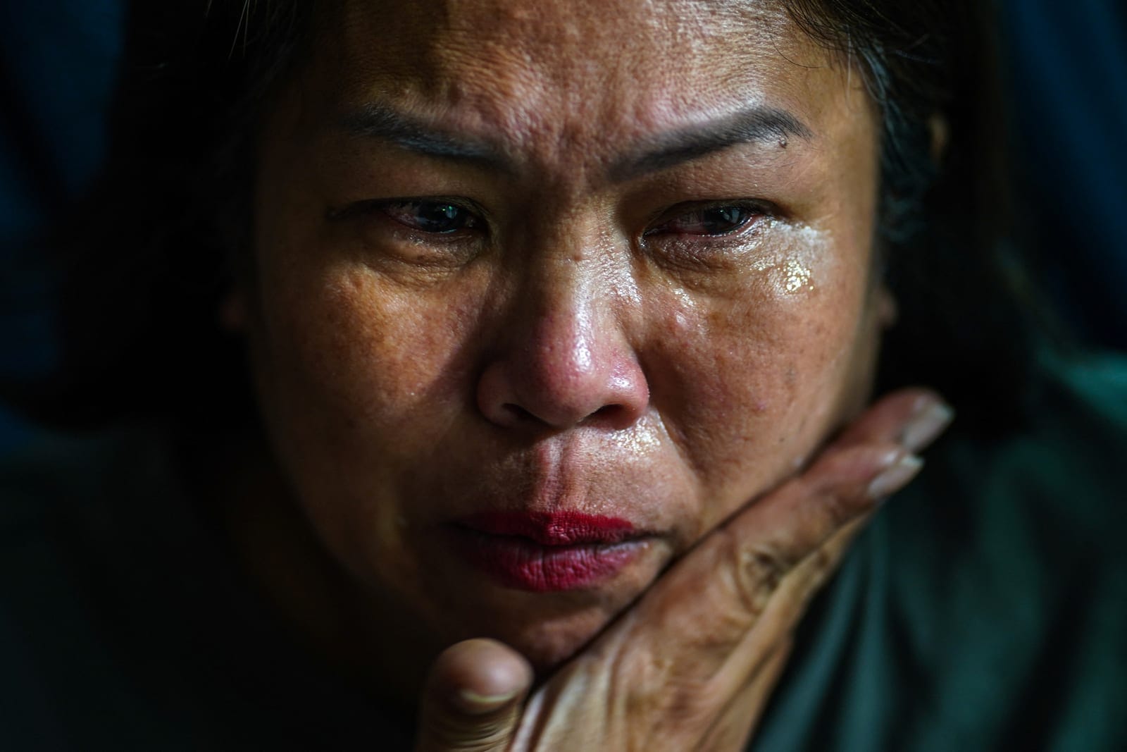 Kavita Wongyakasem, 51, a small-business owner who says she has about 10 million baht in debt, reacts during an interview with Reuters at her house in Nonthaburi province on the outskirts of Bangkok, Thailand, September 23, 2026. REUTERS/Athit Perawo