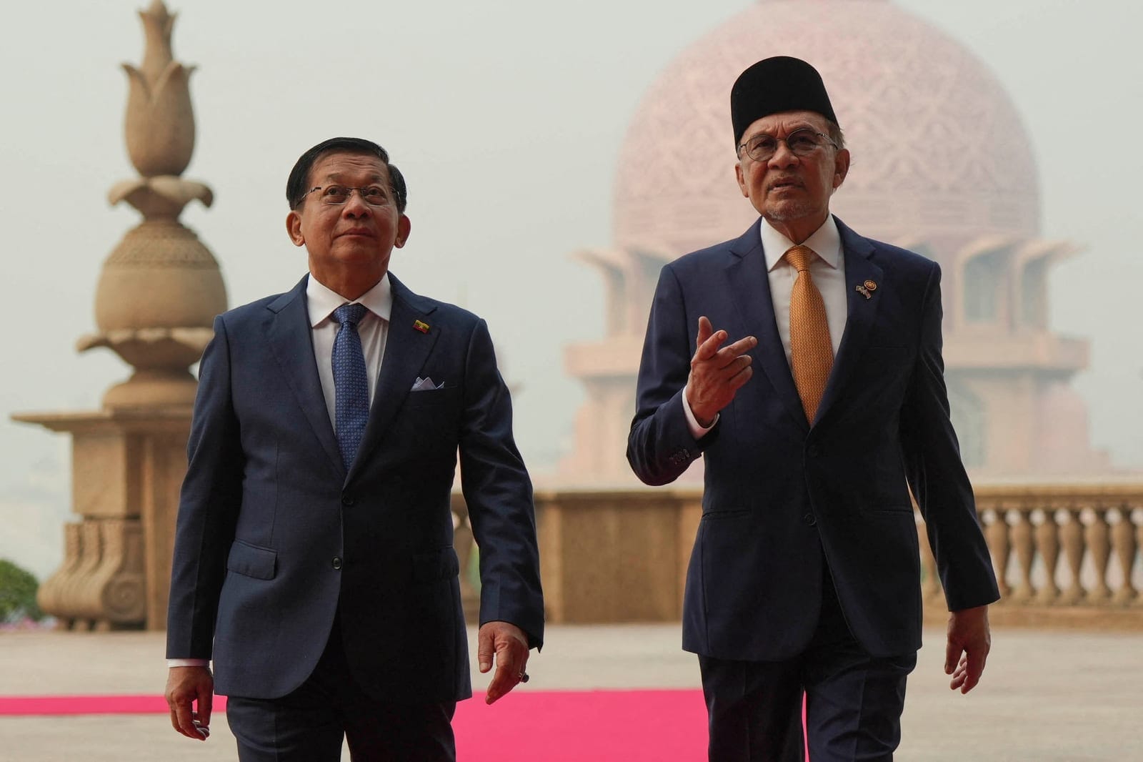 Myanmar’s President Min Aung Hlaing walks with Malaysia’s Prime Minister Anwar Ibrahim during their meeting at the Prime Minister’s Office in Putrajaya, Malaysia, Thursday, Oct. 8, 2026. Azneal Ishak/Pool via REUTERS REUTERS/Azneal Ishak