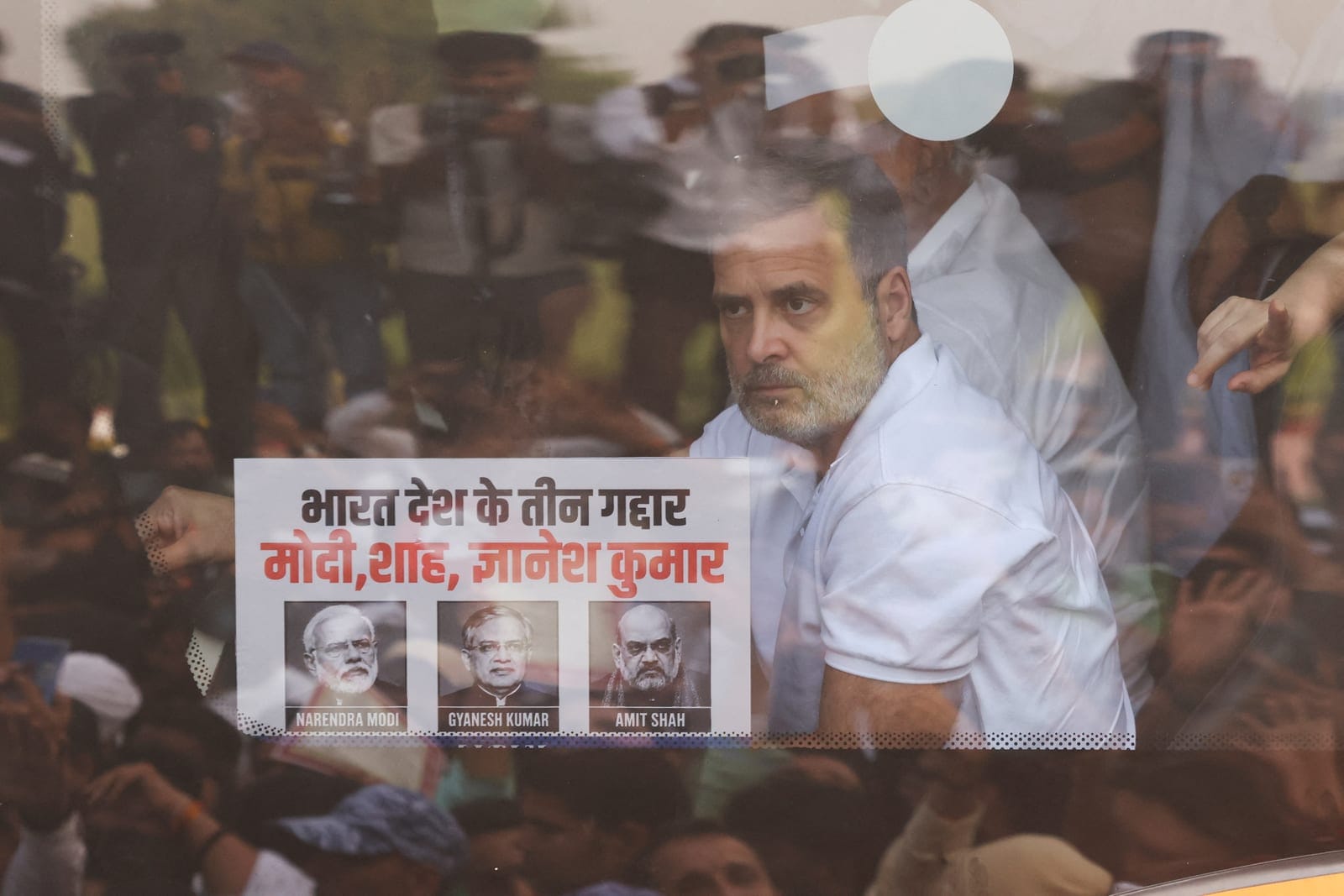 Indian opposition leader Rahul Gandhi sits inside a bus as he heads towards Rajghat during a protest organized by opposition parties demanding the resignation of Chief Election Commissioner Gyanesh Kumar, in New Delhi, India, October 8, 2026. REUTERS