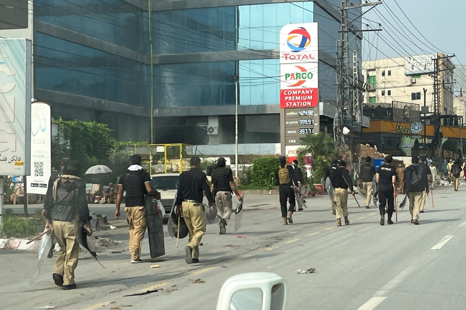 Police walk along a road leading to the Red Zone, in Peshawar, Khyber Pakhtunkhwa province, Pakistan, October 11, 2026. Picture taken with a mobile phone. REUTERS REUTERS/Reuters