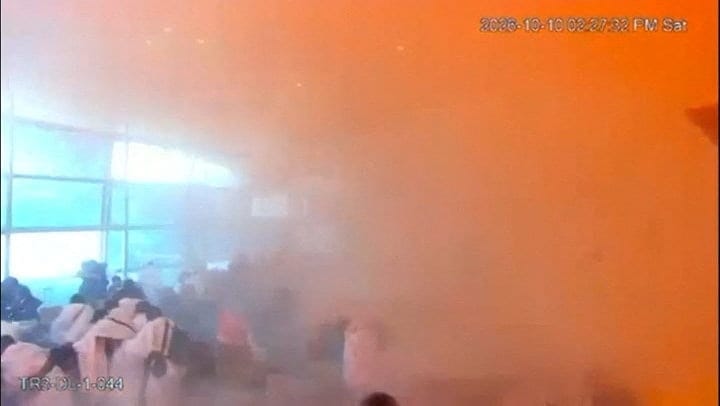 Surveillance footage shows people reacting amid smoke at the moment of an attack at King Khalid International Airport in Riyadh, Saudi Arabia, October 10, 2026, in this frame from a handout video. Saudi Ministry of Media/Handout via REUTERS REUTERS/S