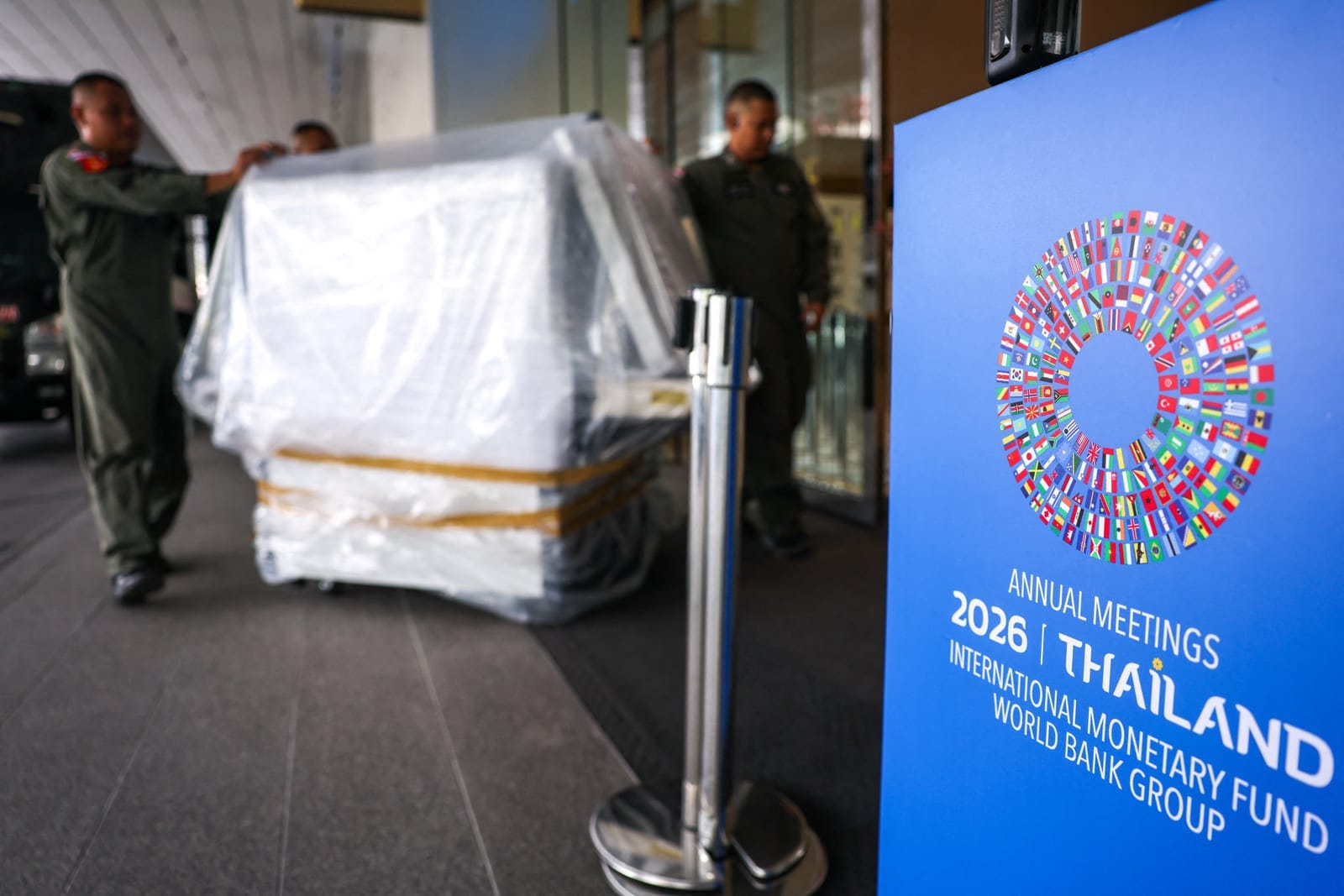 Police officers push an X-ray machine for installation, ahead of the 2026 IMF-World Bank Annual Meetings at Queen Sirikit National Convention Center (QSNCC), in Bangkok, Thailand, October 9, 2026. REUTERS/Athit Perawongmetha