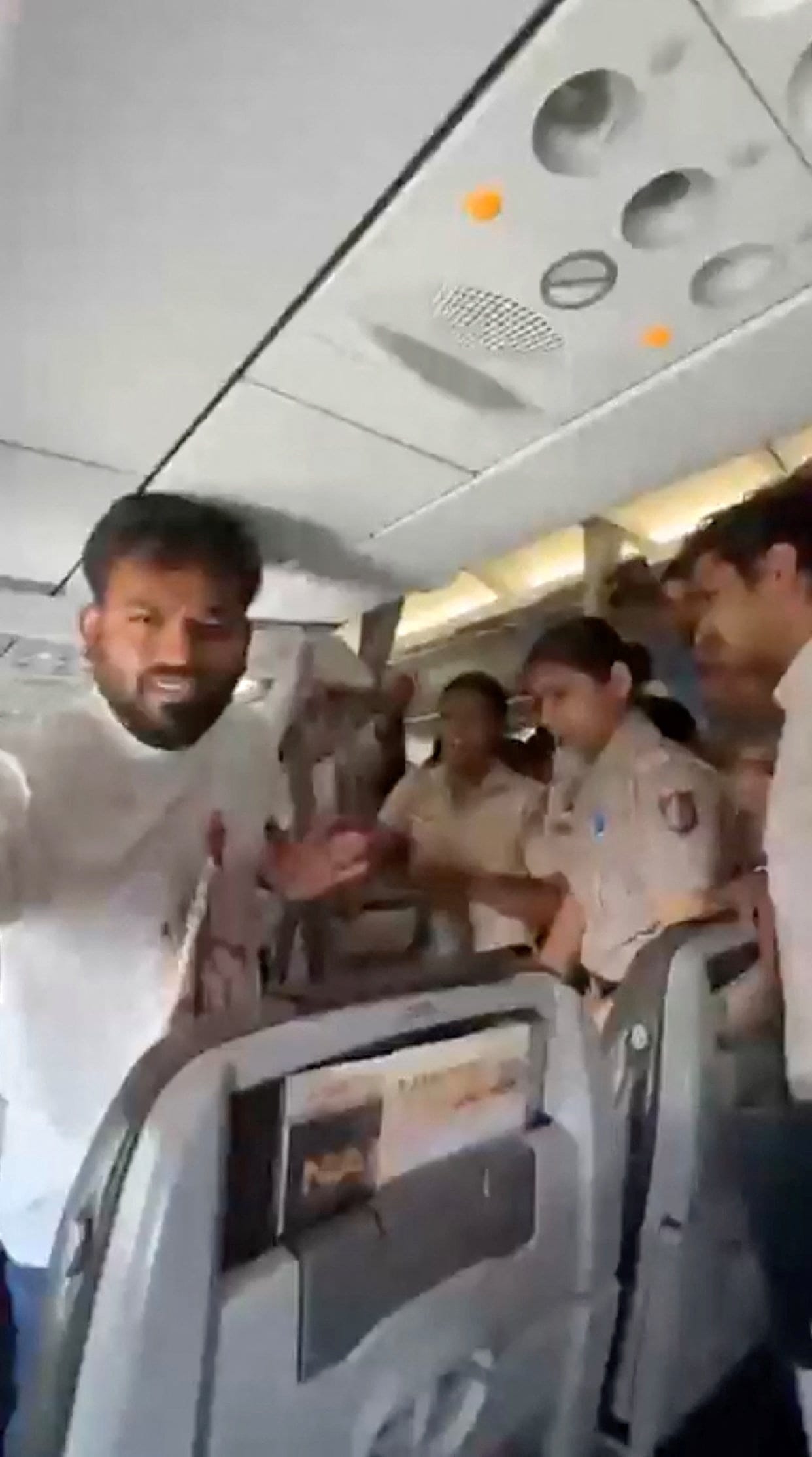 India's Cockroach Janta Party (CJP) founder Abhijeet Dipke is detained by police officers from an aircraft in New Delhi, India, October 10, 2026, in this screengrab obtained from a handout video. Cockroach Janta Party via X/Handout via REUTERS THIS I