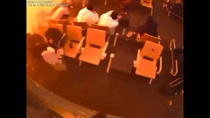 Surveillance footage shows people sitting in a waiting area reacting at the moment of an attack, in a location given as King Khalid International Airport in Riyadh, Saudi Arabia, October 10, 2026, in this frame from a handout video. Saudi Ministry of