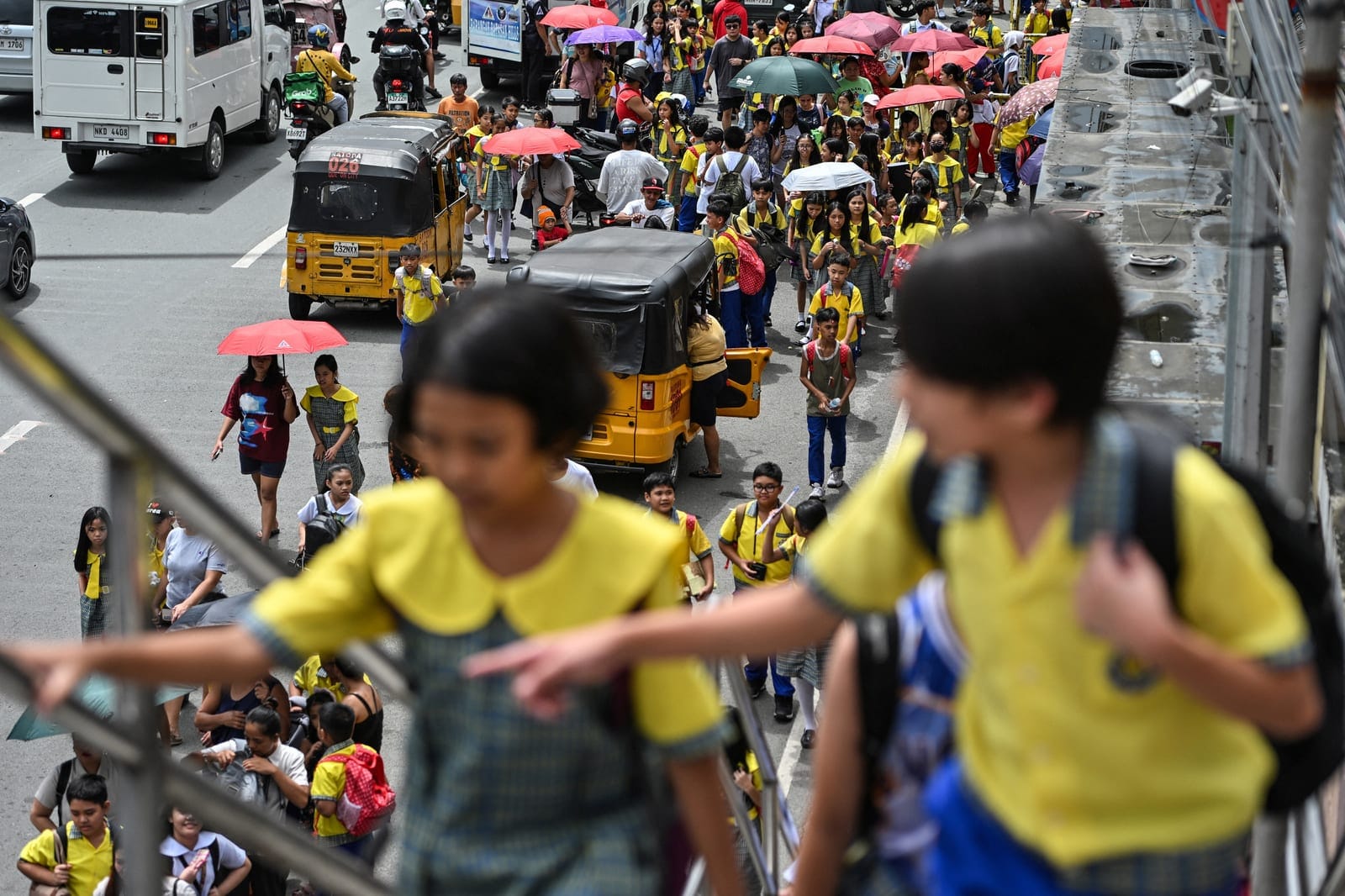 Elementary school students walk as they leave school after class in Quezon City, Philippines, October 12, 2026. REUTERS/Noel Celis