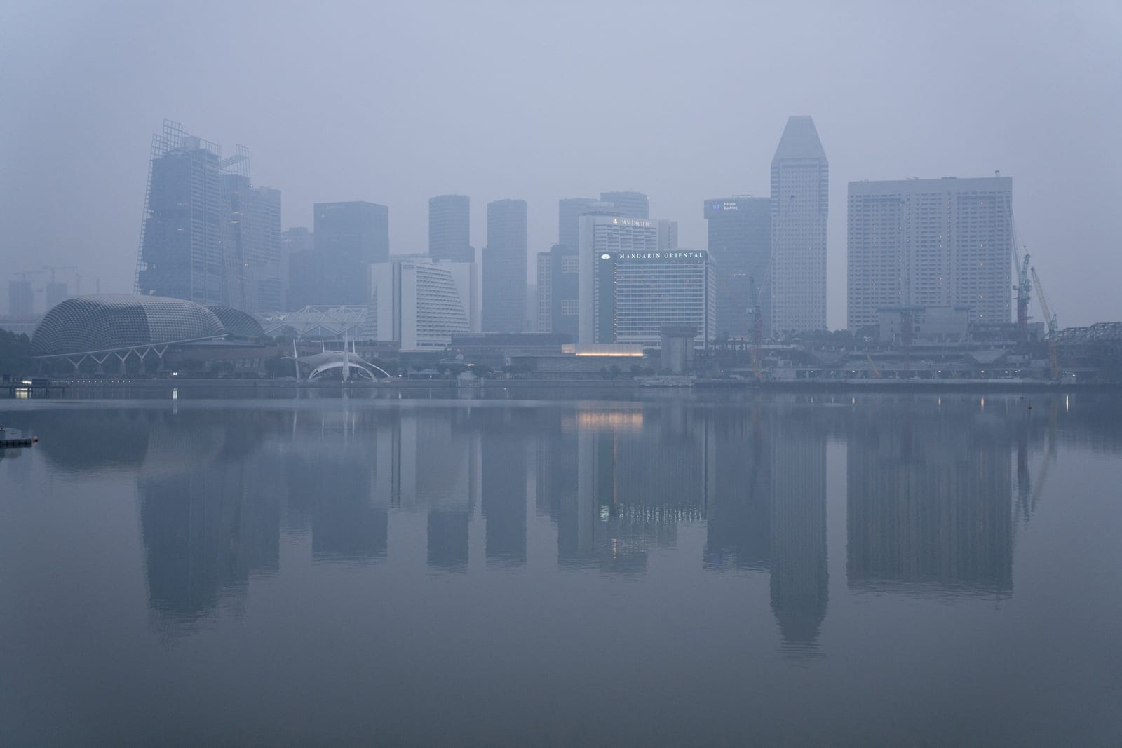 Buildings shrouded in haze from forest fires in neighbouring Indonesia, in Singapore, October 13, 2026. REUTERS/Kokkai Ng