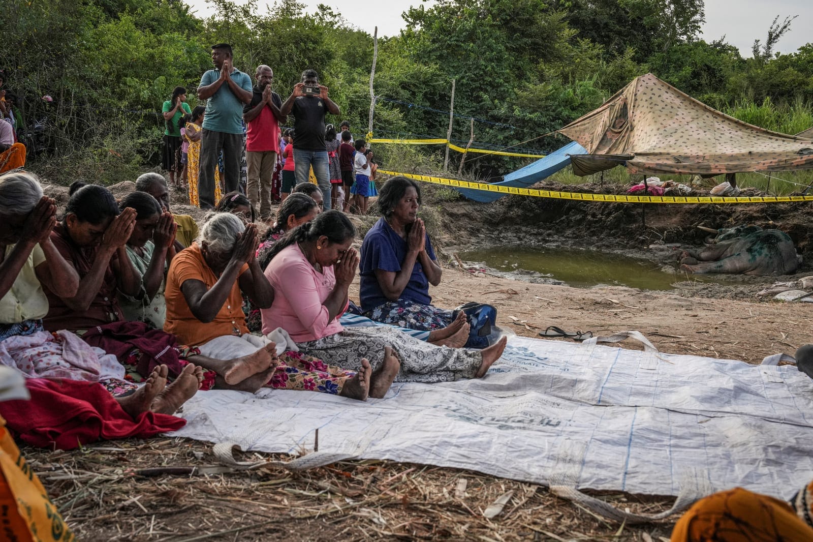 Villagers gather to pay their last respects to a dead wild elephant in Ambanpola, Sri Lanka, July 15, 2025. Sri Lanka's forest cover has plummeted from roughly 70% in the 1920s to about 34% today, World Bank data shows, and as many as 70% of Sri Lank