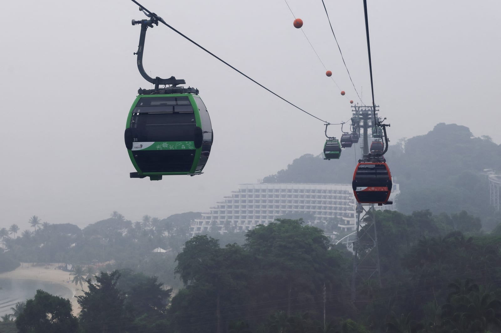 A general view of the cable car line in Sentosa shrouded in haze as smoke from regional forest fires reduces visibility across the island city-state of Singapore, October 14, 2026. REUTERS/Suhaimi Abdullah