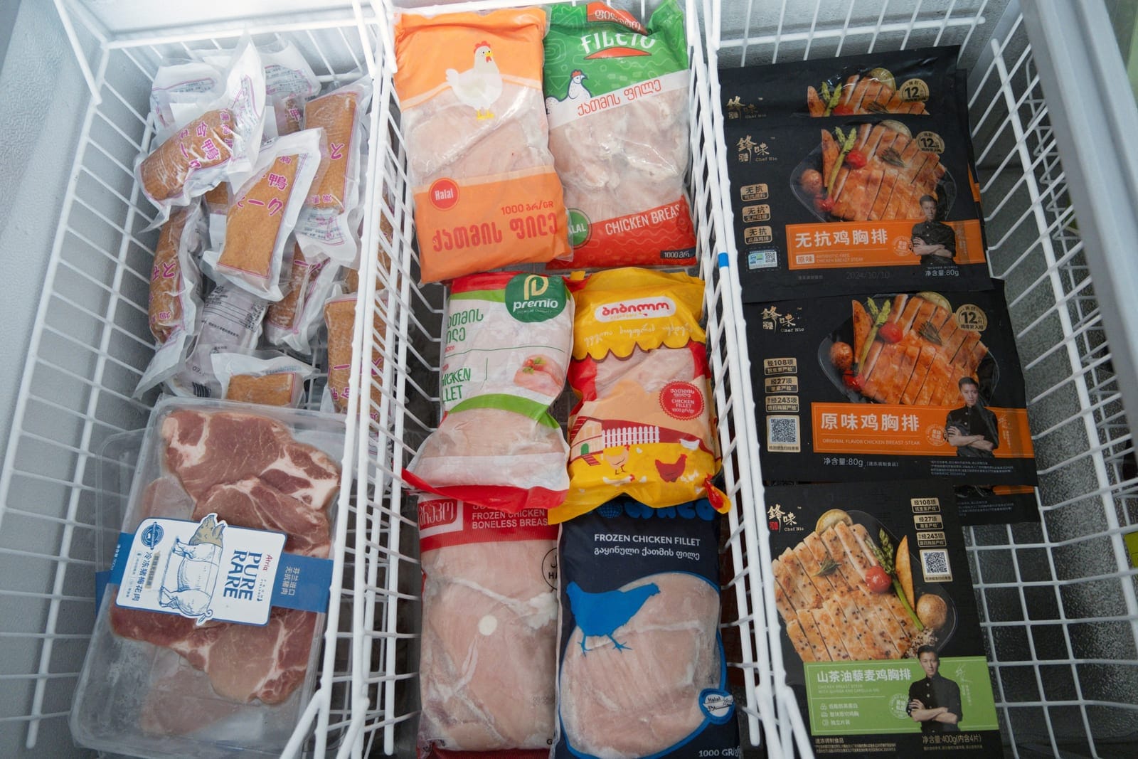 A refrigerator outside Wintop Food Group's chicken products factory displays the company's poultry products for domestic and export markets, in Tengzhou, Shandong province, China August 24, 2026. REUTERS/Ella Cao
