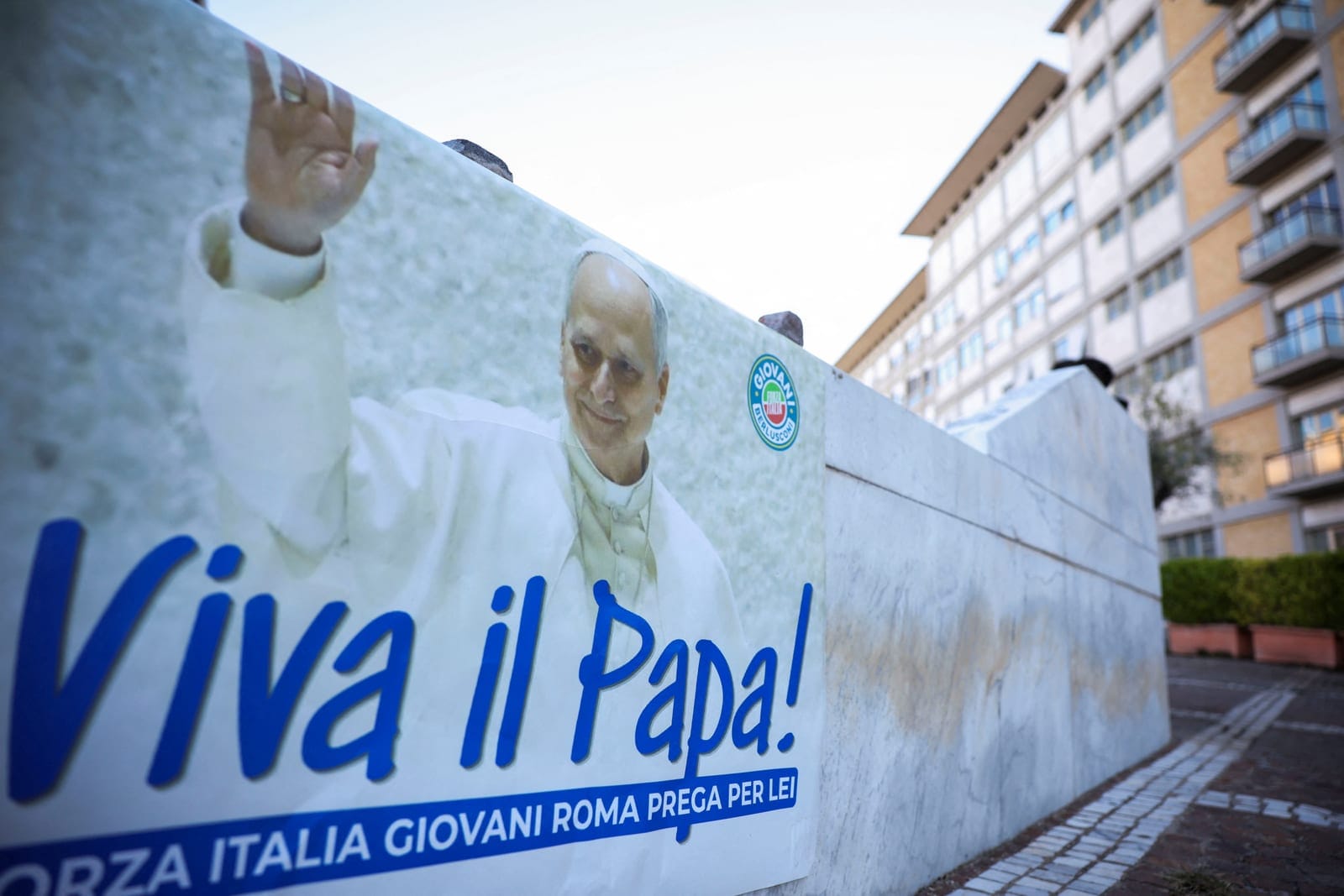 A poster reading "Long live the Pope!" outside Gemelli Hospital after the Vatican said Pope Leo had been diagnosed with lung cancer following surgery to remove part of his right lung, in Rome, Italy, October 15, 2026. REUTERS/Stoyan Nenov