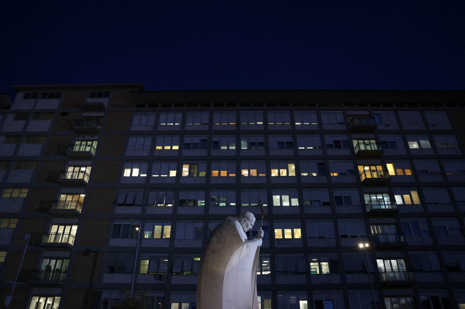 The statue of the late Pope John Paul II outside Gemelli Hospital, where Pope Leo is being treated for lung cancer following surgery to remove part of his right lung, in Rome, Italy, October 14, 2026. REUTERS/Yara Nardi