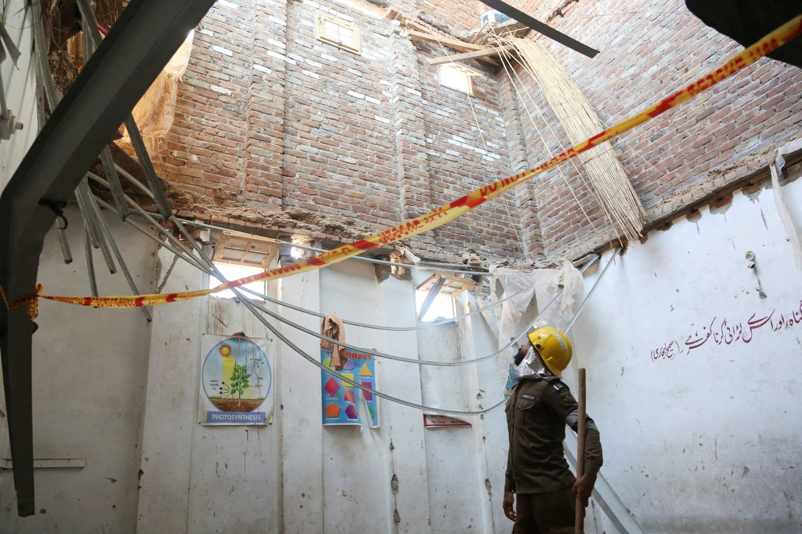 A rescue staff stands in a classroom after a school roof collapse in Peshawar, Pakistan, October 15, 2026. REUTERS REUTERS/Reuters