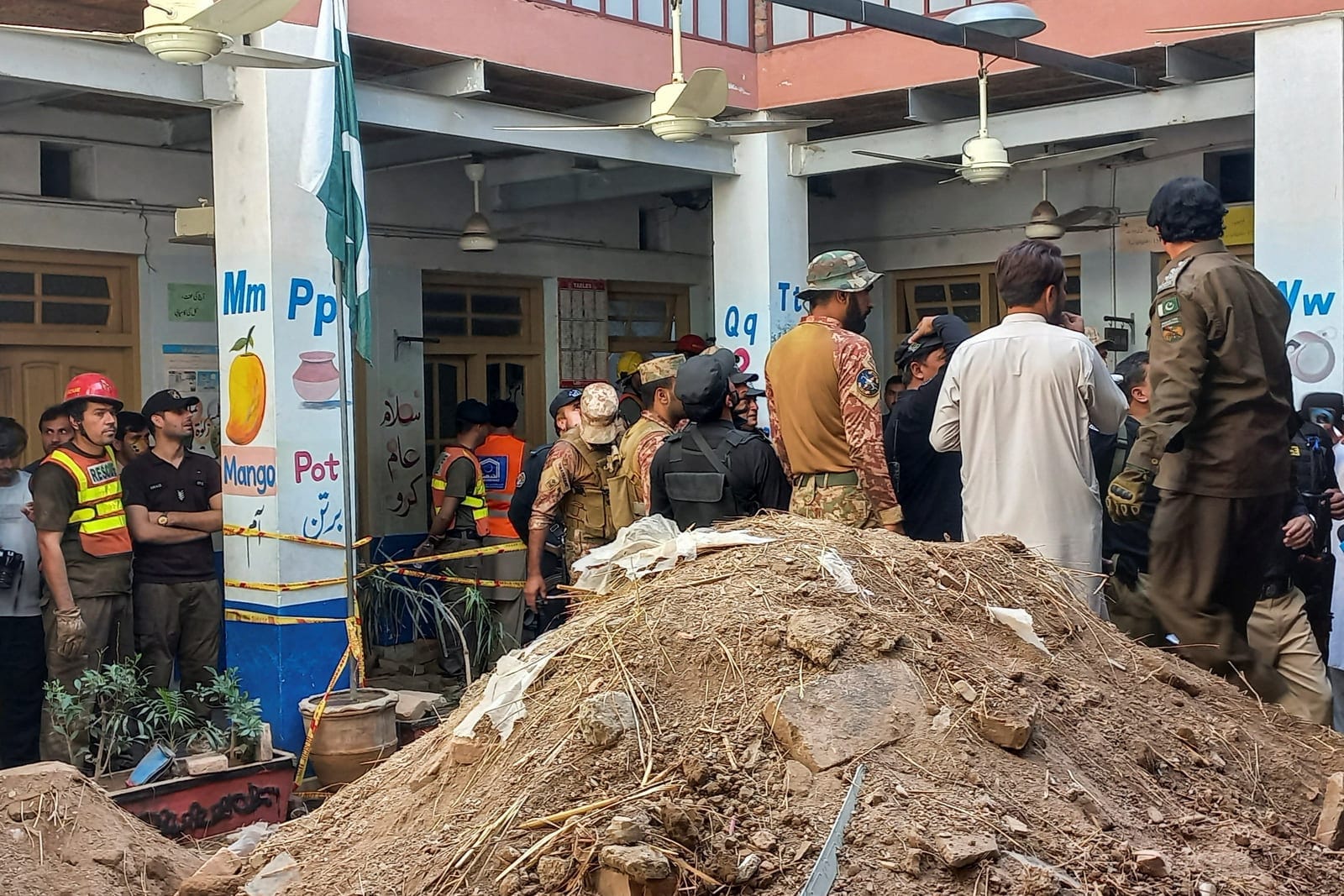 Army soldiers and rescue workers gather after a school roof collapse in Peshawar Pakistan, October 15, 2026. Picture taken with a mobile phone. REUTERS REUTERS/Reuters