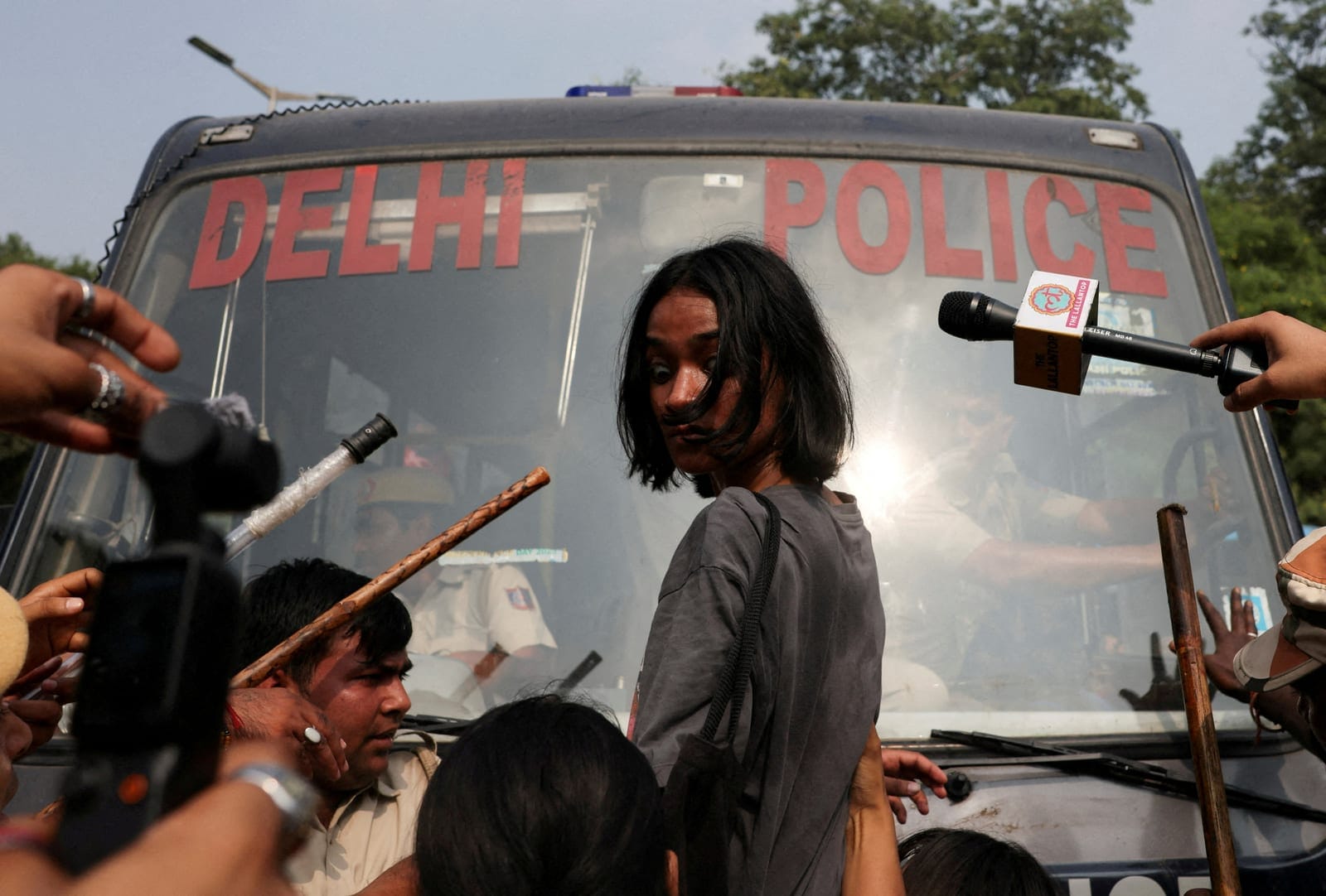 FILE PHOTO: Ananya Raturi, 21, reacts as she tries to stop the police bus carrying detained protesters during a protest organised by the Cockroach Janta Party (CJP), seeking the resignation of India's Chief Election Commissioner, Gyanesh Kumar, in Ne