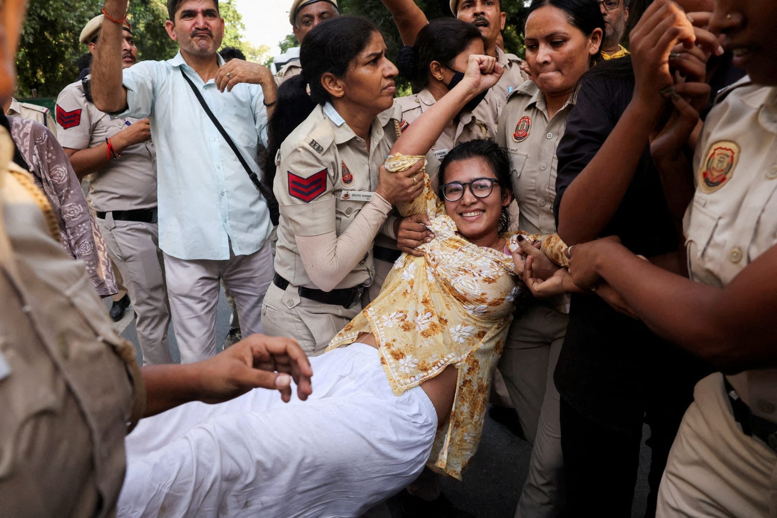 FILE PHOTO: Neha Bora, National President of the All India Students' Association (AISA), reacts as she is detained by police during a protest against alleged assault on female protestors and journalists by Delhi Police and demanding resignation of ch