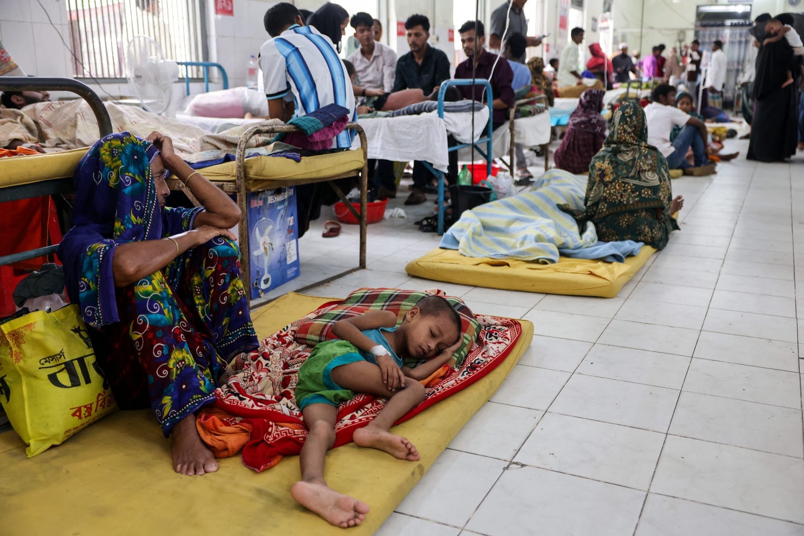 Patients suspected of having measles receive treatment on the floor of the overcrowded measles isolation ward at Shahid Shamsuddin Ahmed Hospital in Sylhet, Bangladesh, September 12, 2026. REUTERS/Mohammad Ponir Hossain