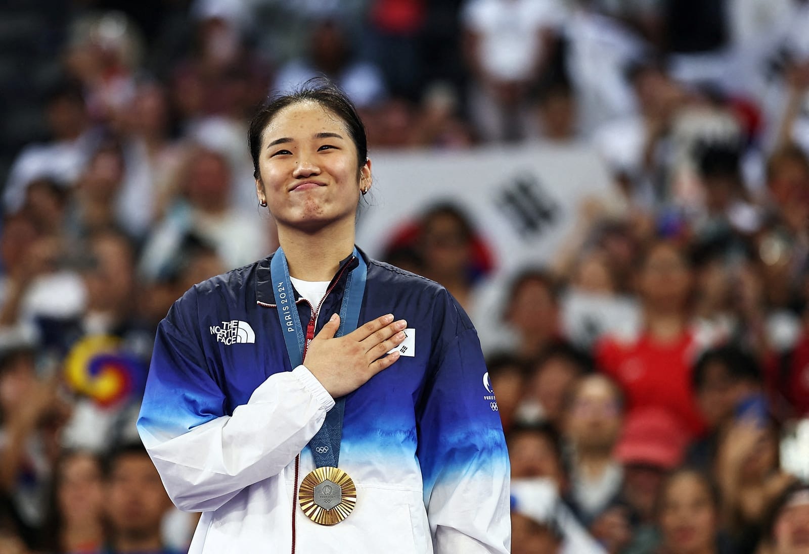 FILE PHOTO: Paris 2024 Olympics - Badminton - Women's Singles Victory Ceremony - Porte de La Chapelle Arena, Paris, France - August 05, 2024. Gold medallist Se Young An of South Korea reacts during the ceremony. REUTERS/Ann Wang/File Photo