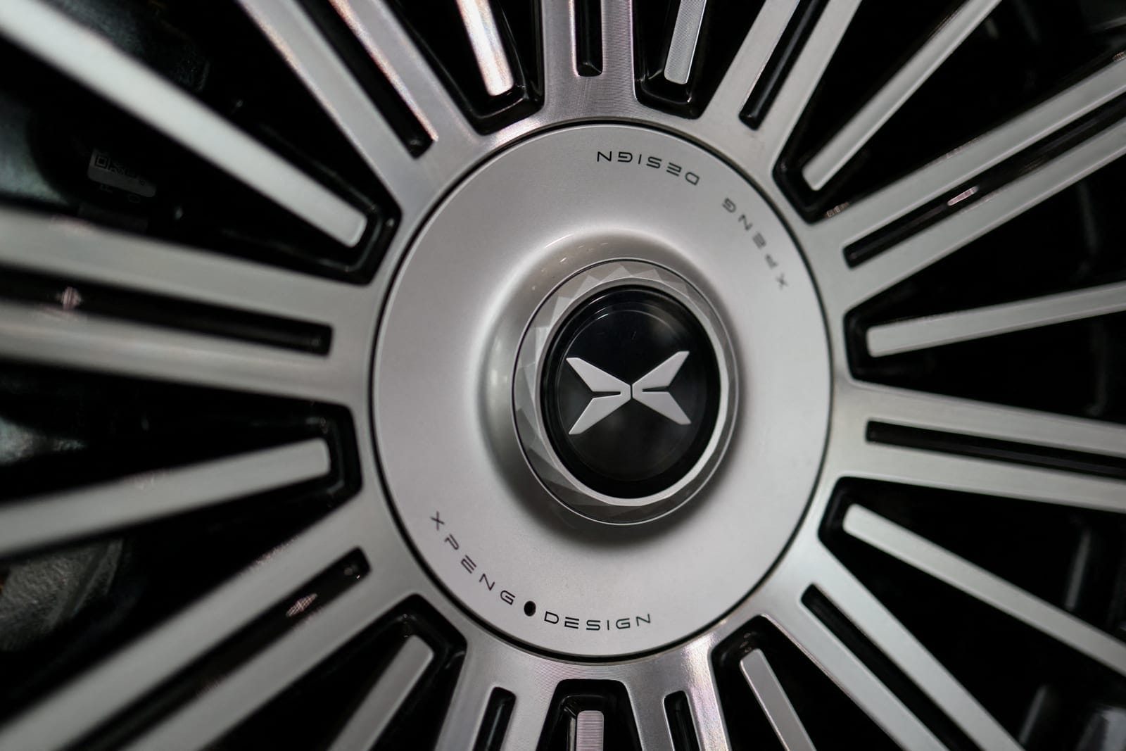 FILE PHOTO: The XPeng logo is displayed on a tire of an XPeng GX SUV, on display at an XPeng dealership, in Beijing, China, April 23, 2026. REUTERS/Tingshu Wang/File Photo