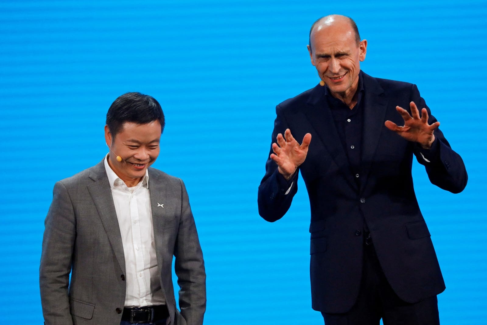 FILE PHOTO: Ralf Brandstaetter, head of Volkswagen China business, and He Xiaopeng, founder and chief executive officer of XPeng, attend a Volkswagen media event in Beijing, China April 24, 2024. REUTERS/Josh Arslan/File Photo